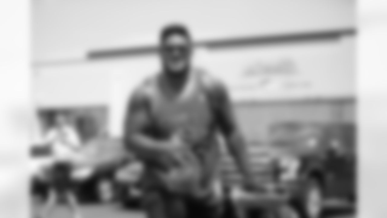 Defensive lineman Kyle Peko arrives for training camp on July 27, 2018.