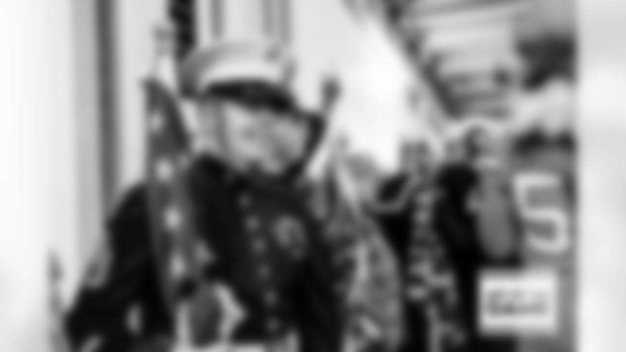 Military service members in the tunnel during player and team introductions before the Broncos' Week 11 game against the Las Vegas Raiders at Empower Field at Mile High in Denver, Colorado on November 20, 2022. (Photo by Ben Swanson)