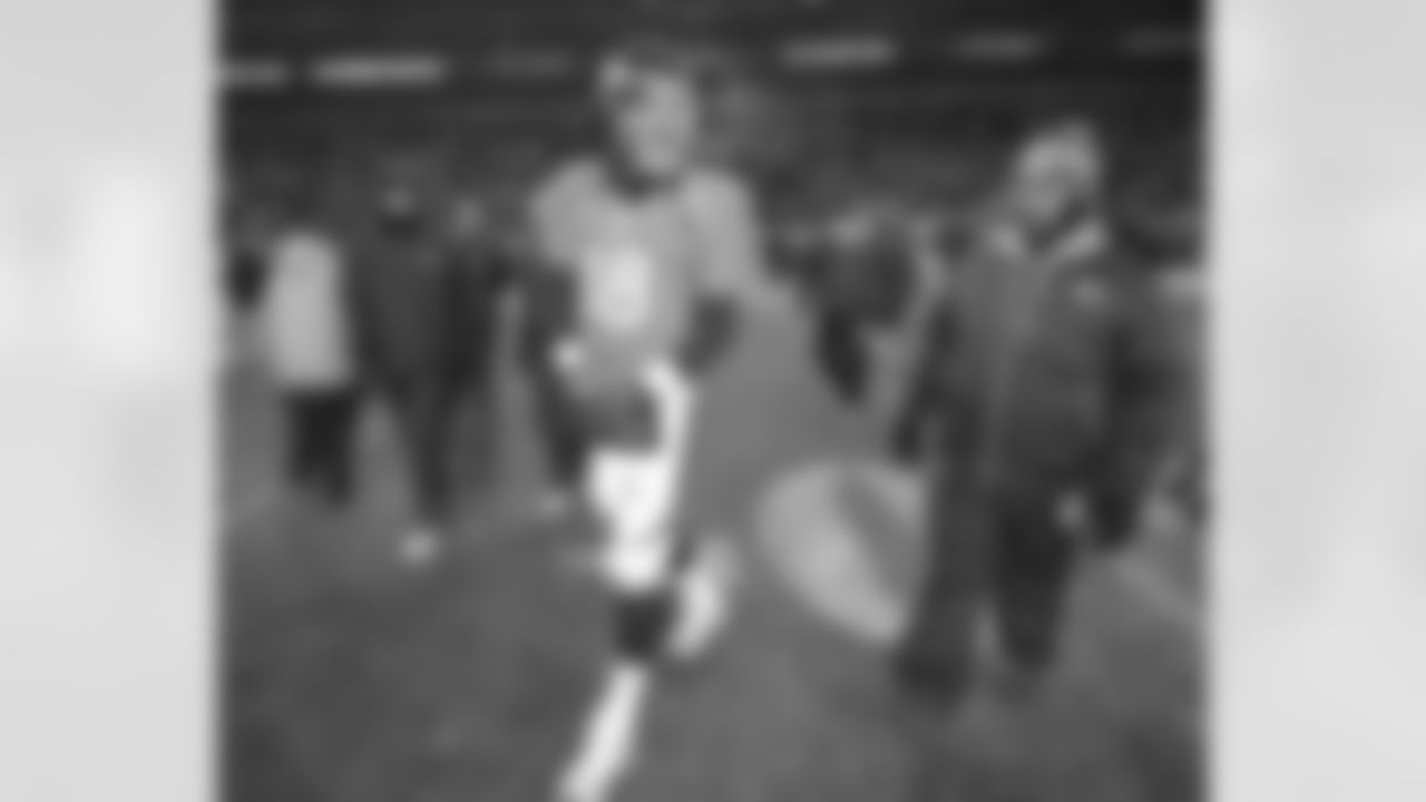 Manning walks off the field after the loss.