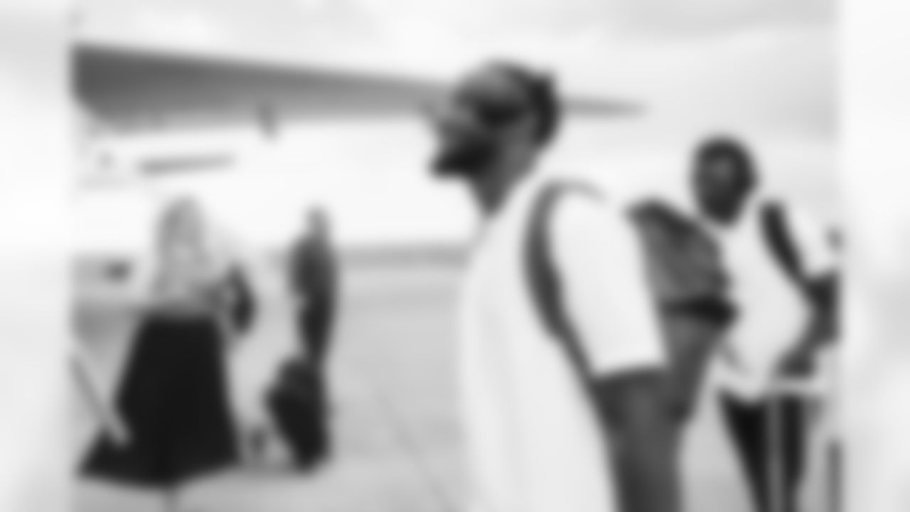 Kendall Hinton on the tarmac at Denver International Airport on October 1, 2022 during the team's travel to Las Vegas for a Week 4 game against the Raiders. (Photo by Ben Swanson)