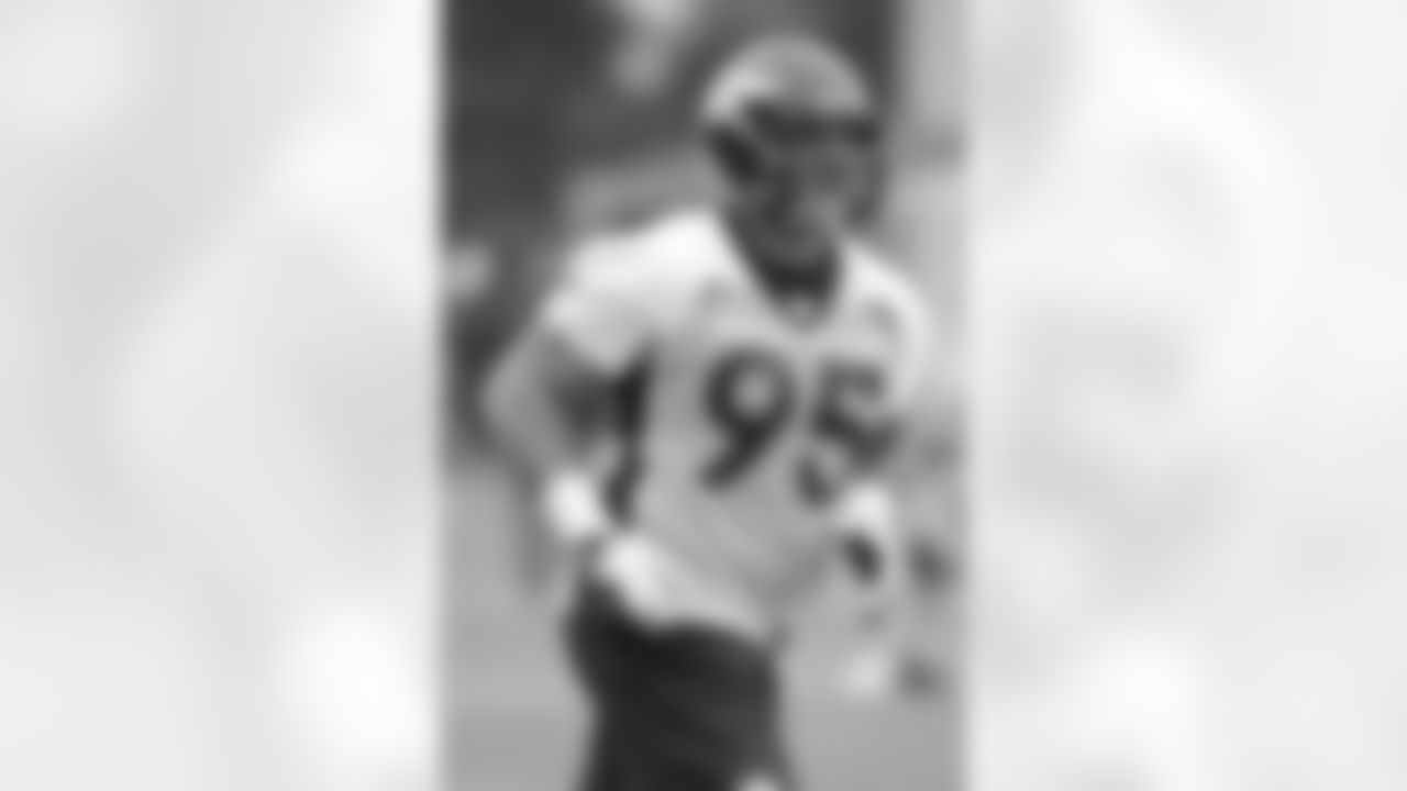 DT Derek Wolfe jogs to the next drill.