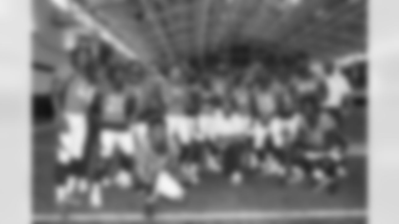 The defensive backs position group — Anthony Harris, Defensive Coordinator Ejiro Evero, Darius Phillips, K'Waun Williams, Caden Sterns, DeAndre Thompson, Justin Simmons, Ronald Darby, Faion Hicks, P.J. Locke, Kareem Jackson, Pat Surtain II, Ja'Quan McMillian, Essang Bassey, Delarrin Turner-Yell, Ola Adams, Damarri Mathis, Defensive Backs Coach Christian Parker and Michael Ojemudia — during team picture day at UCHealth Training Center in Englewood, Colorado, on September 24, 2022. (Photo by Ben Swanson)