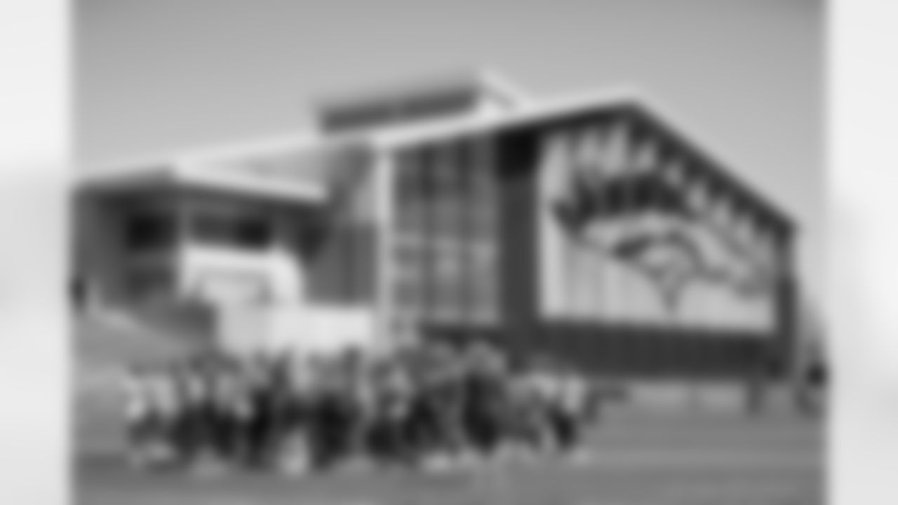 The team huddles up during the ninth day of OTA practices at UCHealth Training Center on June 9, 2021. (Photo by Ben Swanson)