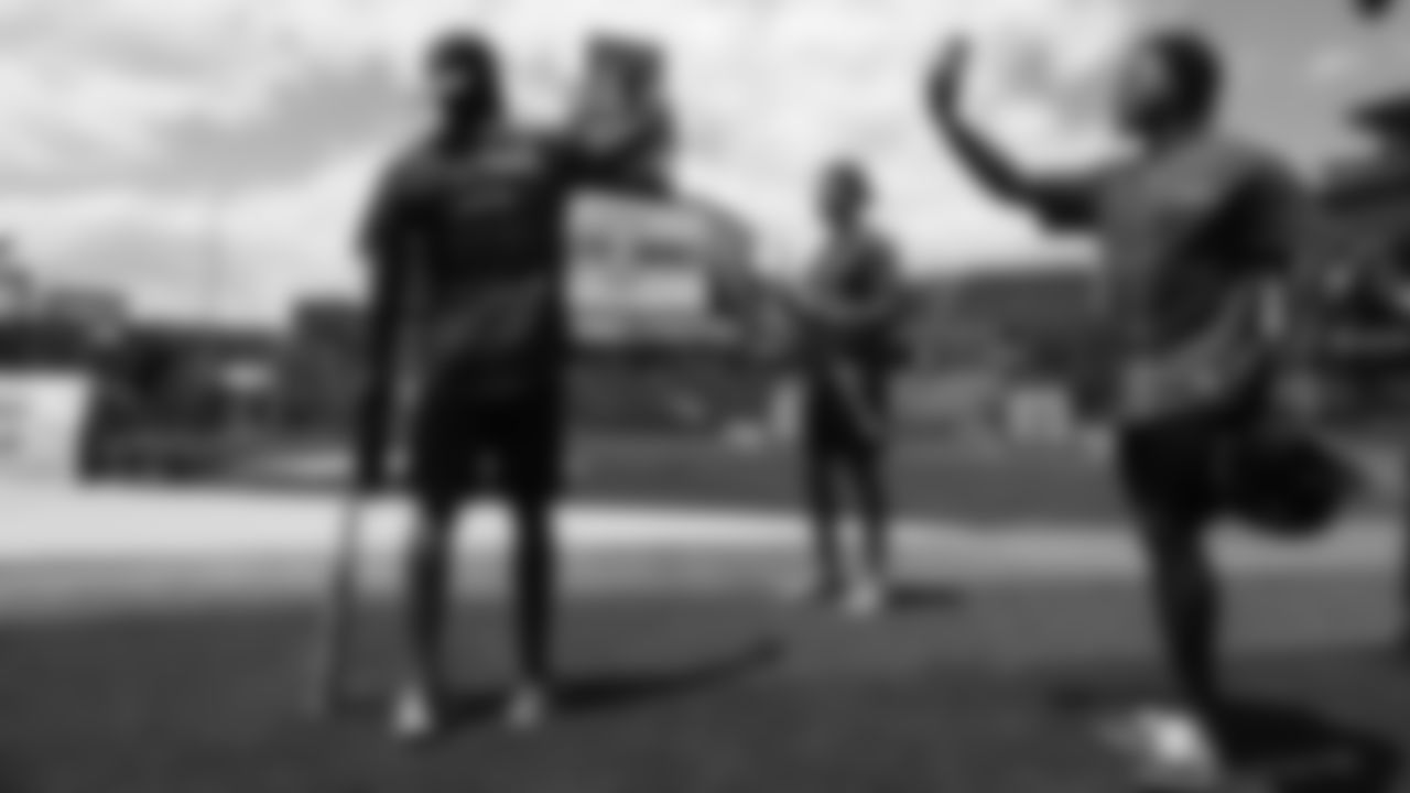 Kareem Jackson, Justin Simmons and Shamarko Thomas take in the scene before UCHealth's Healthy Swings Charity Home Run Derby to benefit The Leukemia & Lymphoma Society- Rocky Mountain Chapter at Coors Field on June 11, 2019.