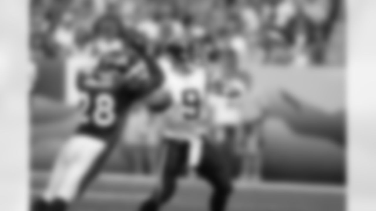 Kenoy Kennedy knocks the ball away from Drew Brees during the NFL game against the San Diego Chargers on September 26, 2004 at Invesco Field at Mile High in Denver, Colorado.