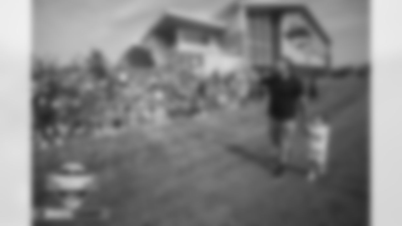 Derek Wolfe and his daughter Roxie (3) walks along the berm to wave to fans as he announces he is retiring as a Bronco during training camp on Friday, July 29, 2022 at UCHealth Training Center in Englewood, Englewood.
Photo by Gabriel Christus/Denver Broncos