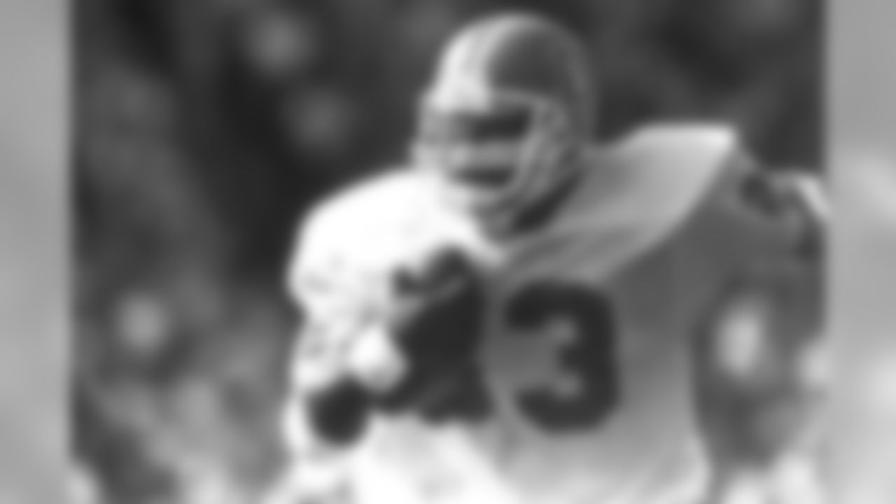 Gene Lang runs the ball versus Cleveland. In four seasons in Denver, Lang totaled 757 rushing yards and 10 rushing touchdowns.