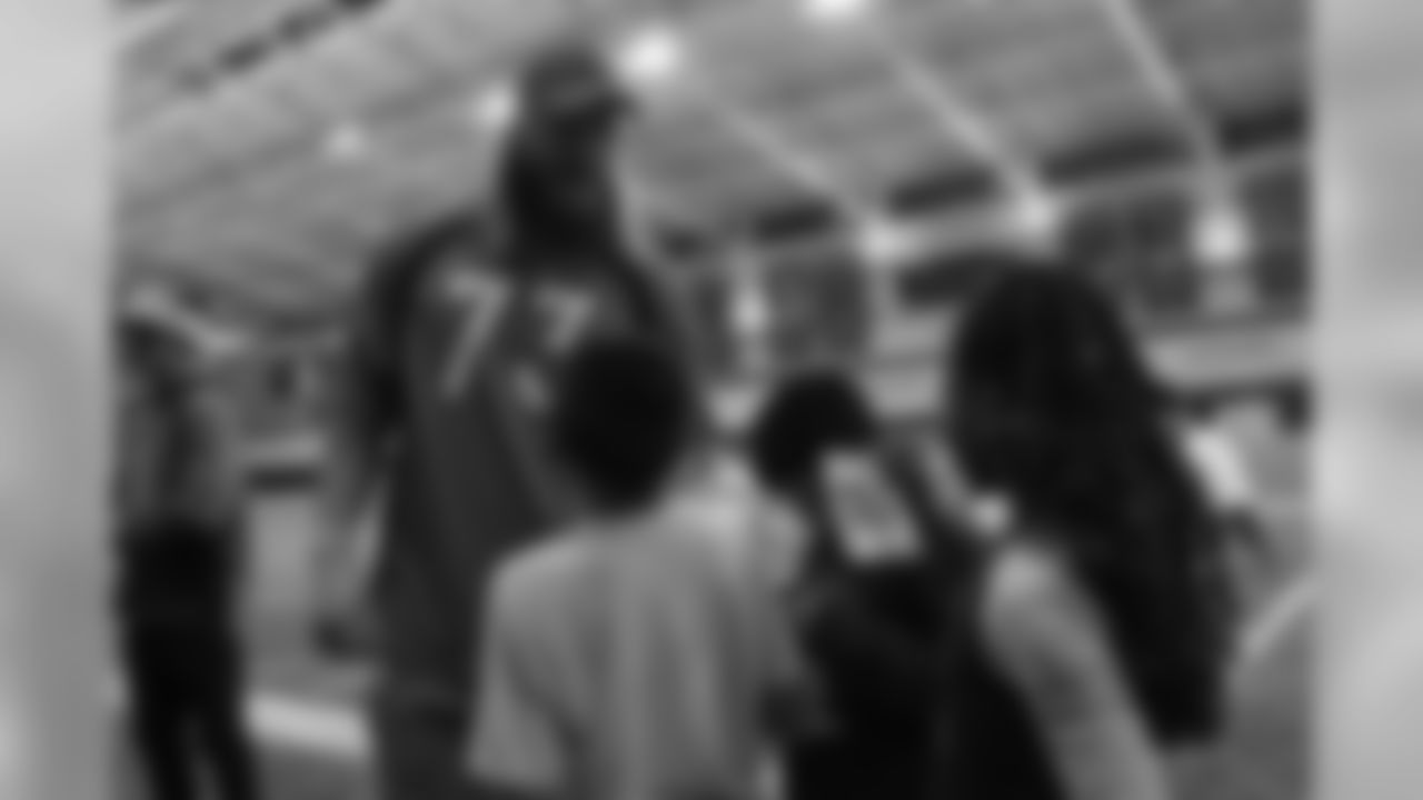 Andreas Knappe talks with kids at the Broncos' Boys & Girls Club holiday party for about 200 children from the Boys & Girls Clubs of Metro Denver at UCHealth Training Center on December 17, 2018.