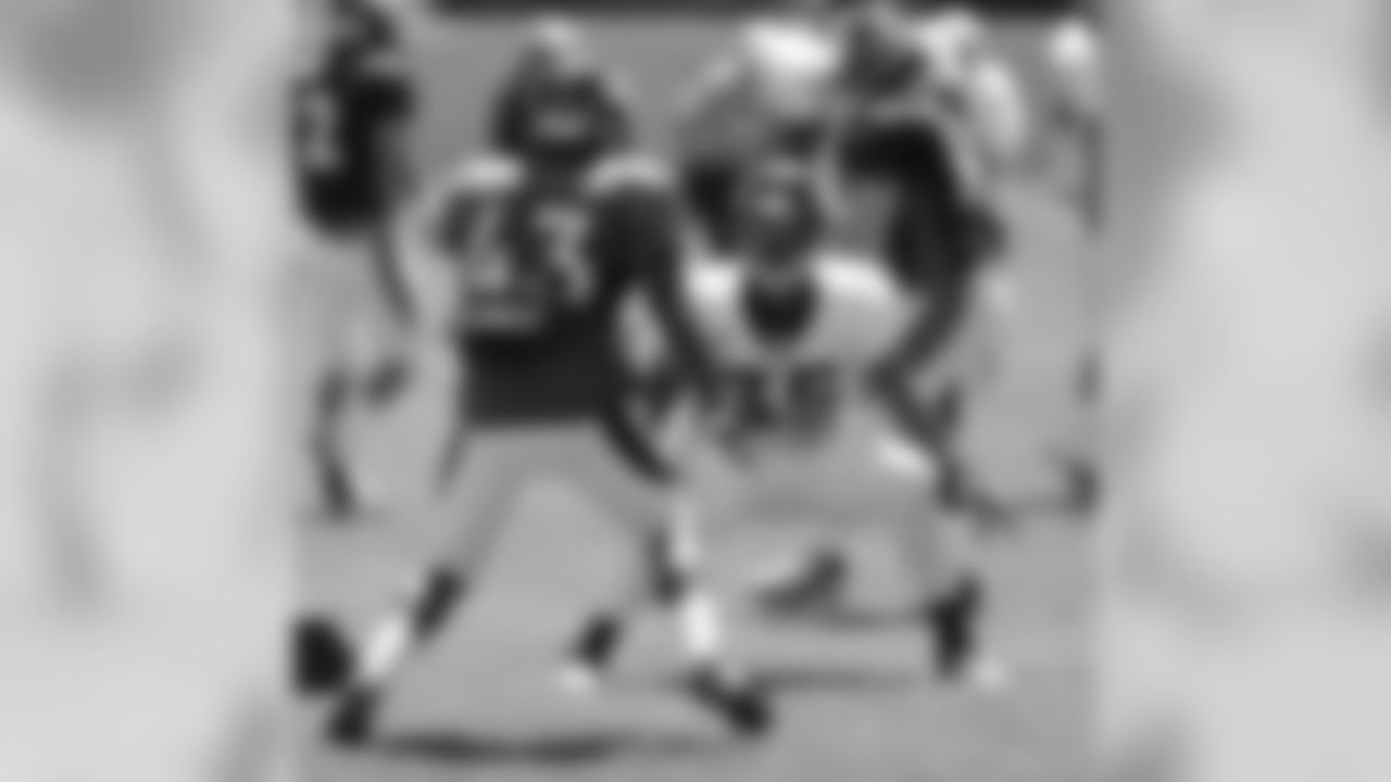 Ball blocks blitzing S Anthony Perkins.