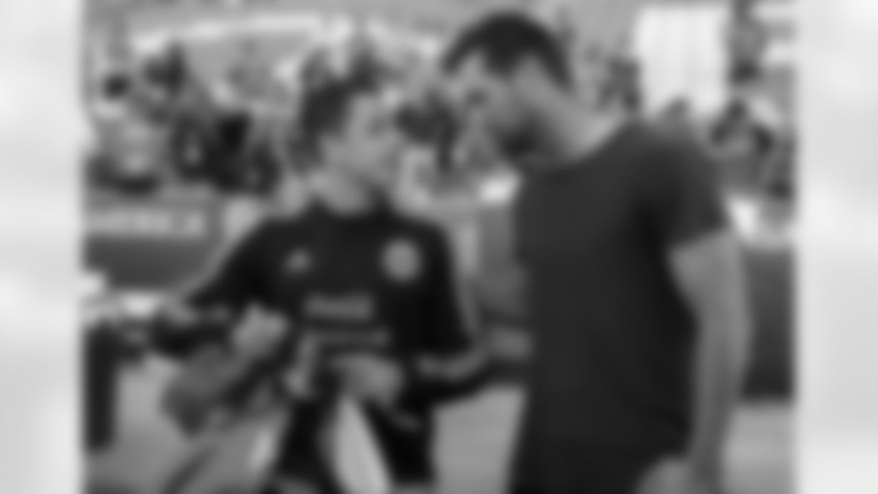 Javier "Chicharito" Hernandez talks with Brandon McManus at the Mexican national soccer team's practice in Denver.