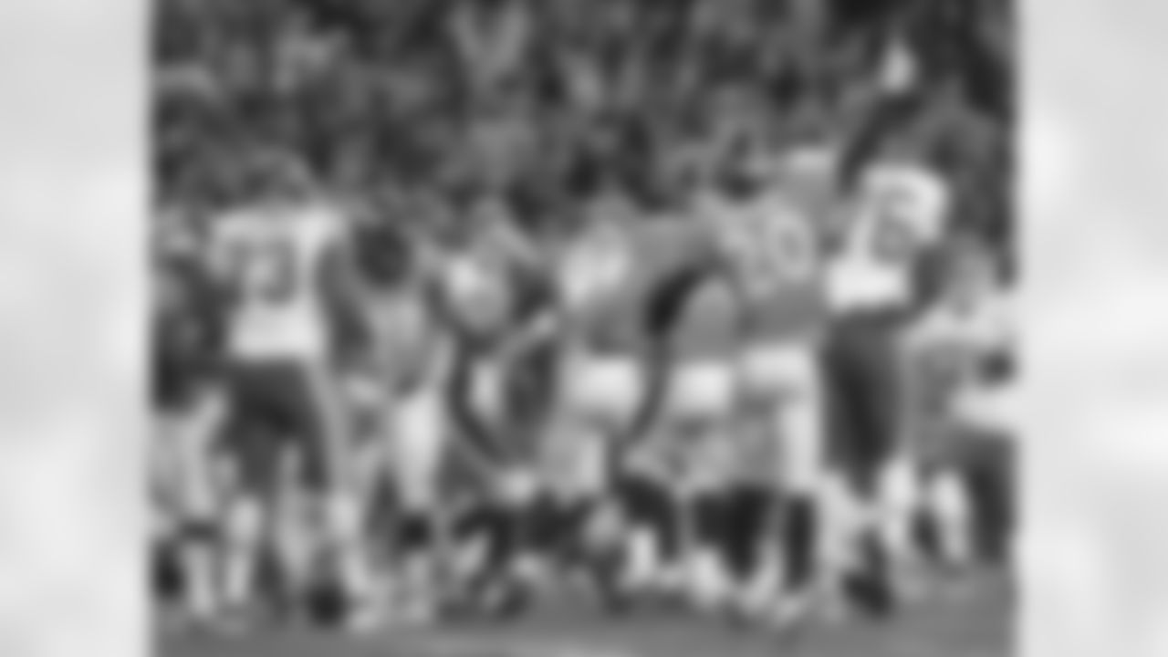 Broncos Defenders Celebrate a Stop