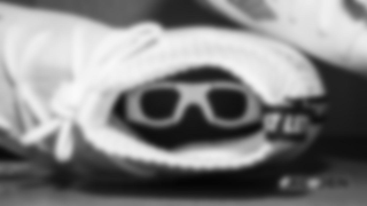 The interior of Von Miller's cleats, which includes a nod to his passion for eyewear, in the locker room pregame before the Broncos' Week 4 game against the Kansas City Chiefs at Broncos Stadium at Mile High on October 1, 2018.