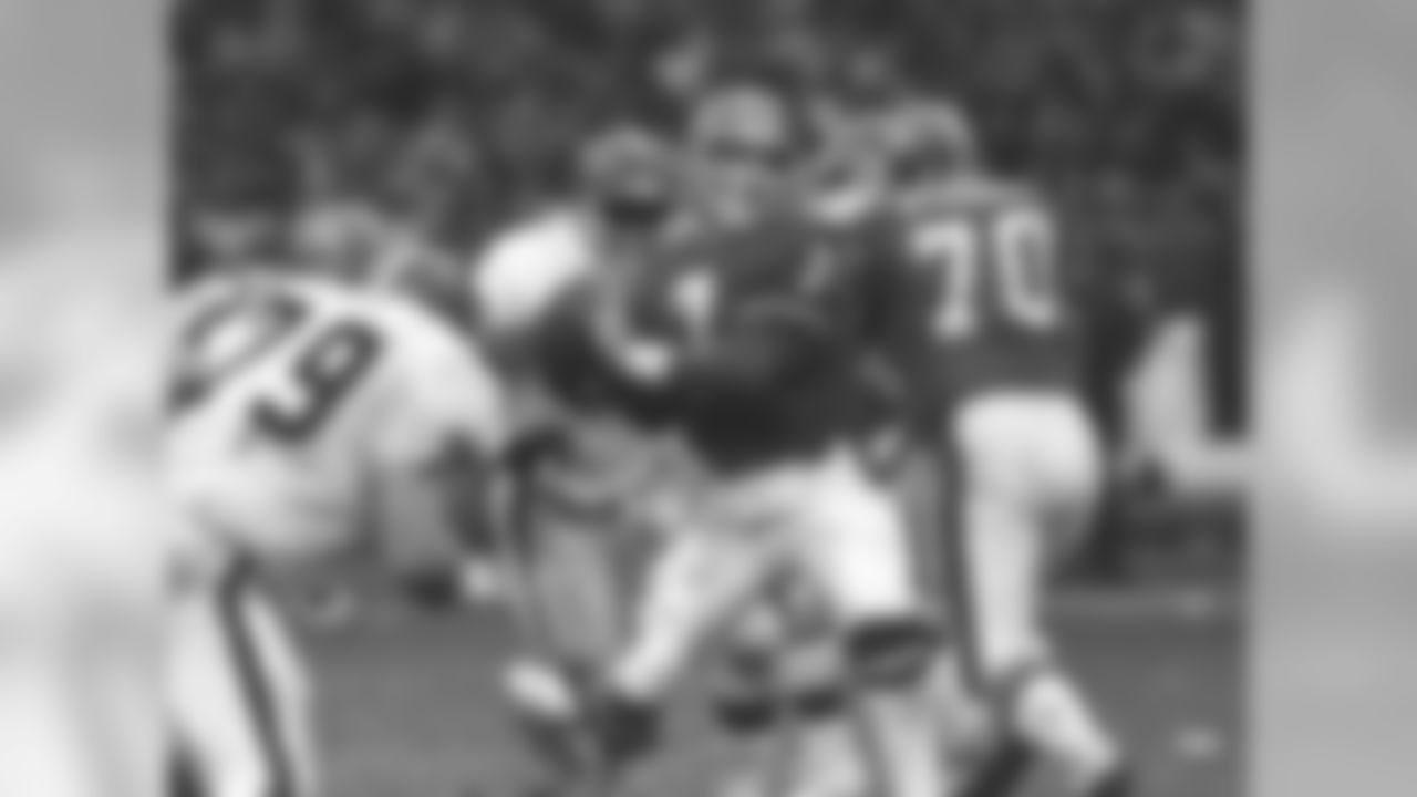 John Elway drops back to pass in the Broncos' 23-20 overtime victory over the Browns, known in NFL lore as "The Drive."