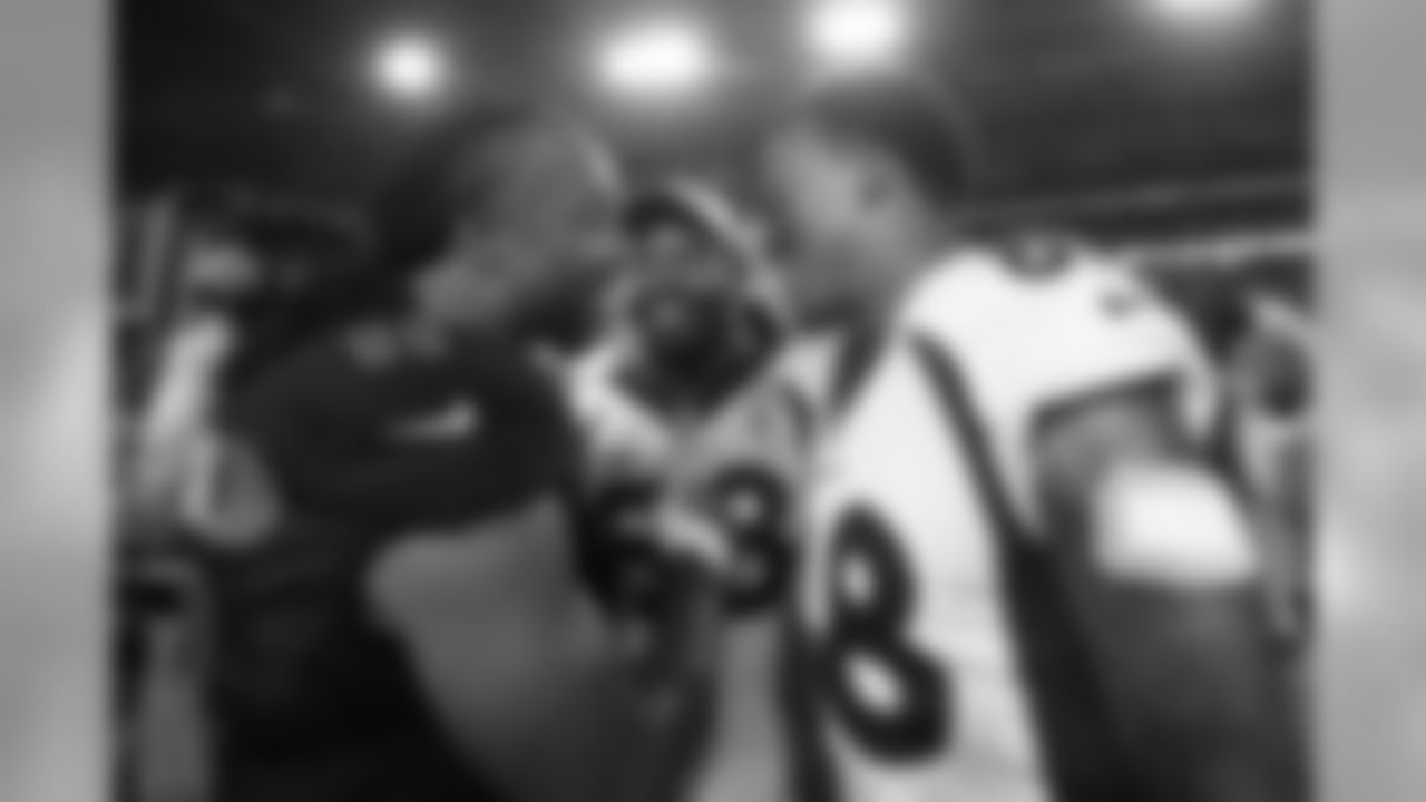 Demaryius Thomas and Von Miller greet Cardinals receiver Larry Fitzgerald after the Broncos' game against the Arizona Cardinals on Oct. 18, 2018.