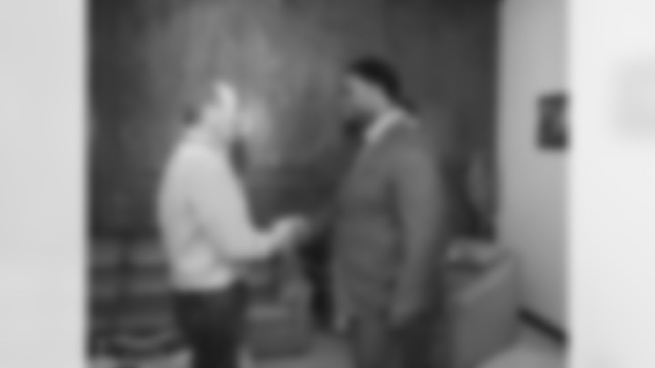 Williams shakes hands with Mr. Bowlen.