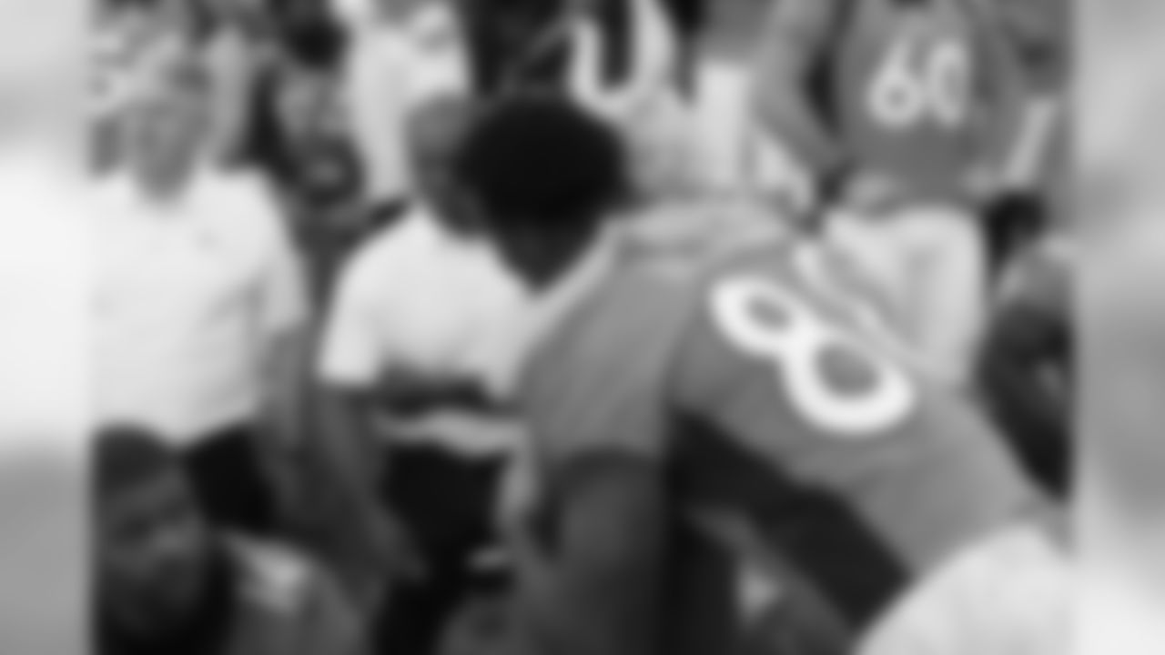 Annabel Bowlen, representing Broncos Owner Pat Bowlen, hugs Denver Broncos wide receiver Demaryius Thomas (88) before the team photo on Oct. 4, 2017.