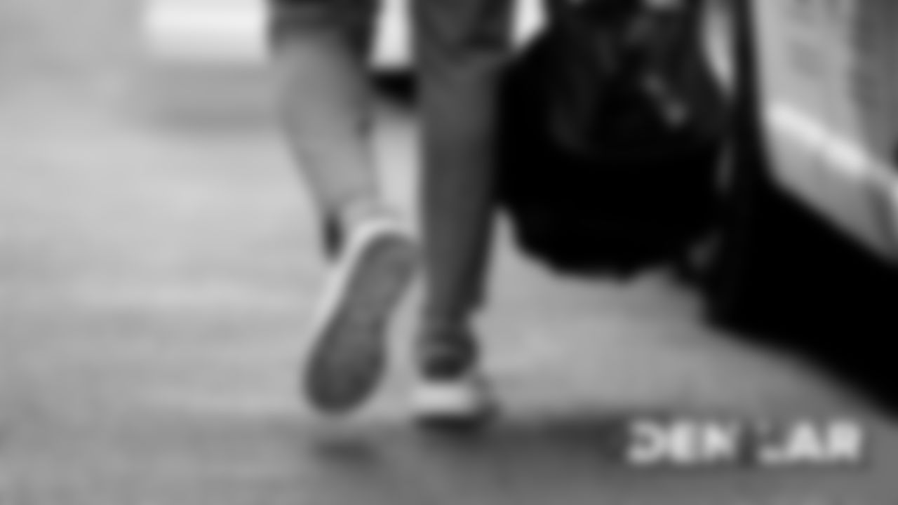 A player's sneakers during the walk to the team buses for the Broncos' travel to Los Angeles on August 23, 2019 ahead of their game against the Rams. (Photo by Ben Swanson)