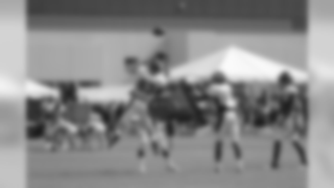 Welker makes the catch while preparing to get hit by blocking pads.