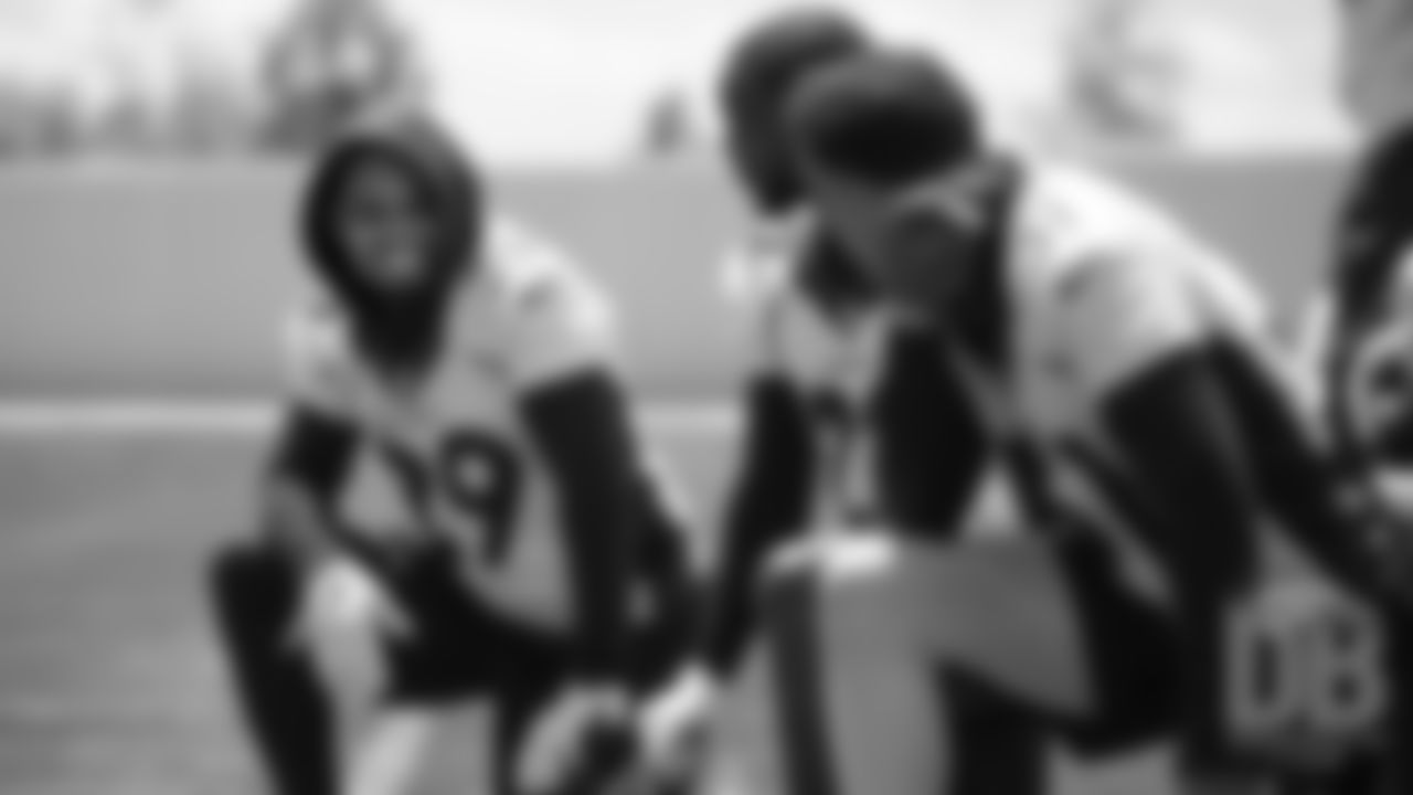 Bryce Callahan talks with Kareem Jackson and Justin Simmons during the Broncos' practice on the ninth day of their OTAs on May 31, 2019.