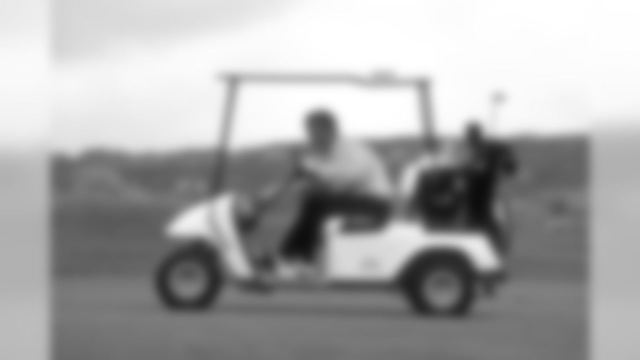 Coach Mike Shanahan rides in a cart at the June 9, 1997 Mike Shanahan Golf Classic.