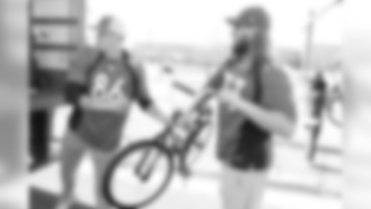Tim Semisch (left) and Andreas Knappe during a bike distribution at Green Valley Elementary School in Denver on December 18, 2018.