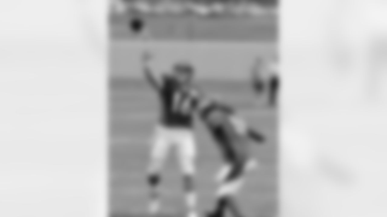 QB Caleb Hanie throws a pass downfield.