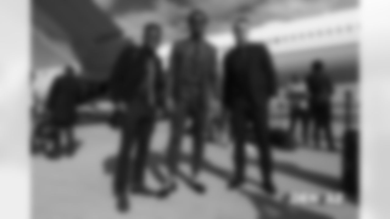 Isaiah McKenzie, Demaryius Thomas and River Cracraft walks on the tarmac to the plane before the flight during the team's travel for their Week 7 game against the Arizona Cardinals on October 17, 2018.