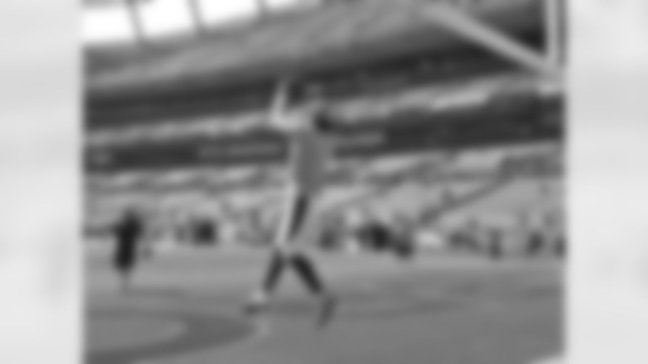 WR Eric Decker jumps up to catch a pass during warmups for his team's division opener.