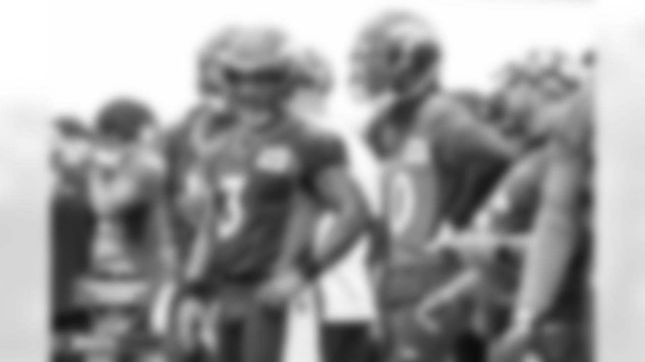 Russell Wilson talks with Jerry Jeudy at practice on Day 2 of training camp at UCHealth Training Center in Englewood, Colorado on July 28, 2022. (Photo by Ben Swanson)