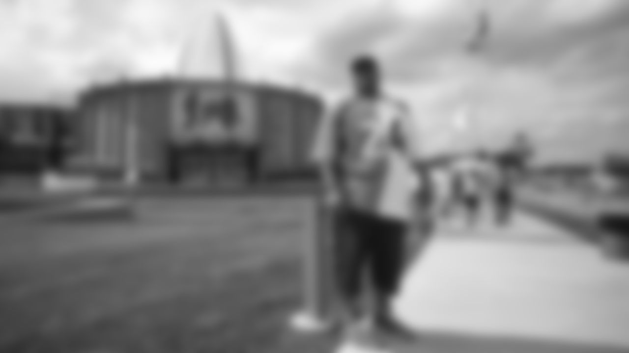 A Broncos fan in front of the Pro Football Hall of Fame before the Broncos' preseason matchup with the Falcons in the Pro Football Hall of Fame Game on August 1, 2019 at Tom Benson Hall of Fame Stadium.