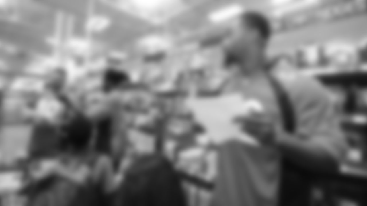 Justin Hollins with kids from the Denver Broncos Boys & Girls Club during the fourth annual Back to School with the Broncos shopping spree at King Soopers on July 16, 2019.