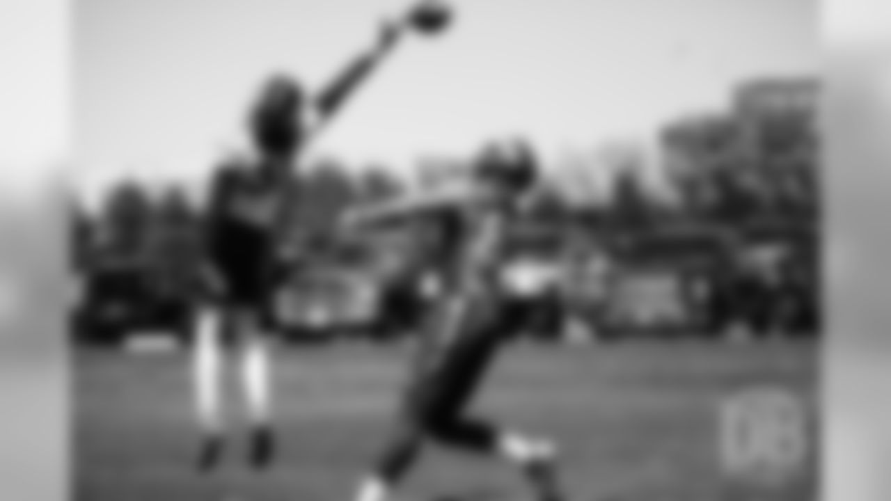 Justin Simmons tips a pass intended for Noah Fant during the Broncos' practice on the eight day of their OTAs on May 30, 2019.