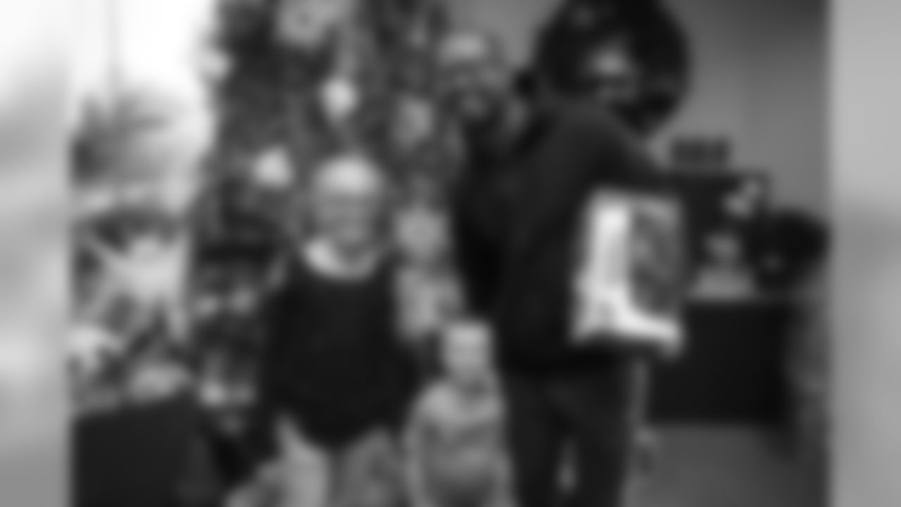Von Miller takes photos with fans to help encourage donations at a toy drive for Boys & Girls Clubs of Metro Denver for the holidays on December 23, 2019. (Photo by Ben Swanson)