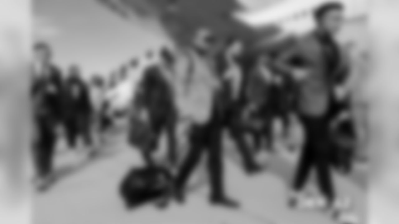 Chris Harris Jr. walks on the tarmac to the plane before the flight during the team's travel for their Week 7 game against the Arizona Cardinals on October 17, 2018.