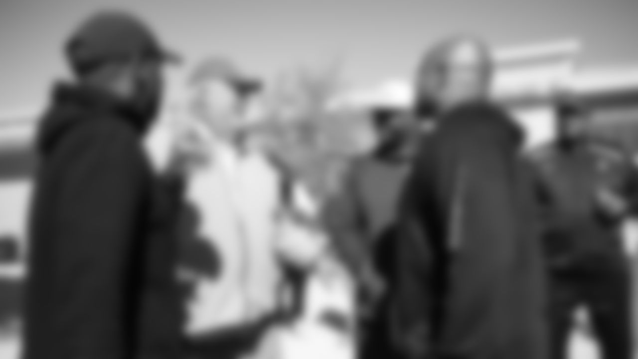 Barney Chavous and Al Wilson and other Broncos alumni watch the team's walkthrough and meet with current players and coaches afterward on October 12, 2019. (Photo by Ben Swanson)