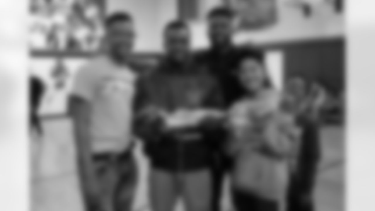 wide receiver Emmanuel Sanders (10) visits the Broncos Boys and Girls Club on November 28, 2017. He presented a Boostbox full of signed Broncos memorabilia and tech gear to Foune Fofana. here kids from the club show off his custom shoes for My Cause My Cleats. (Liz Mannis)