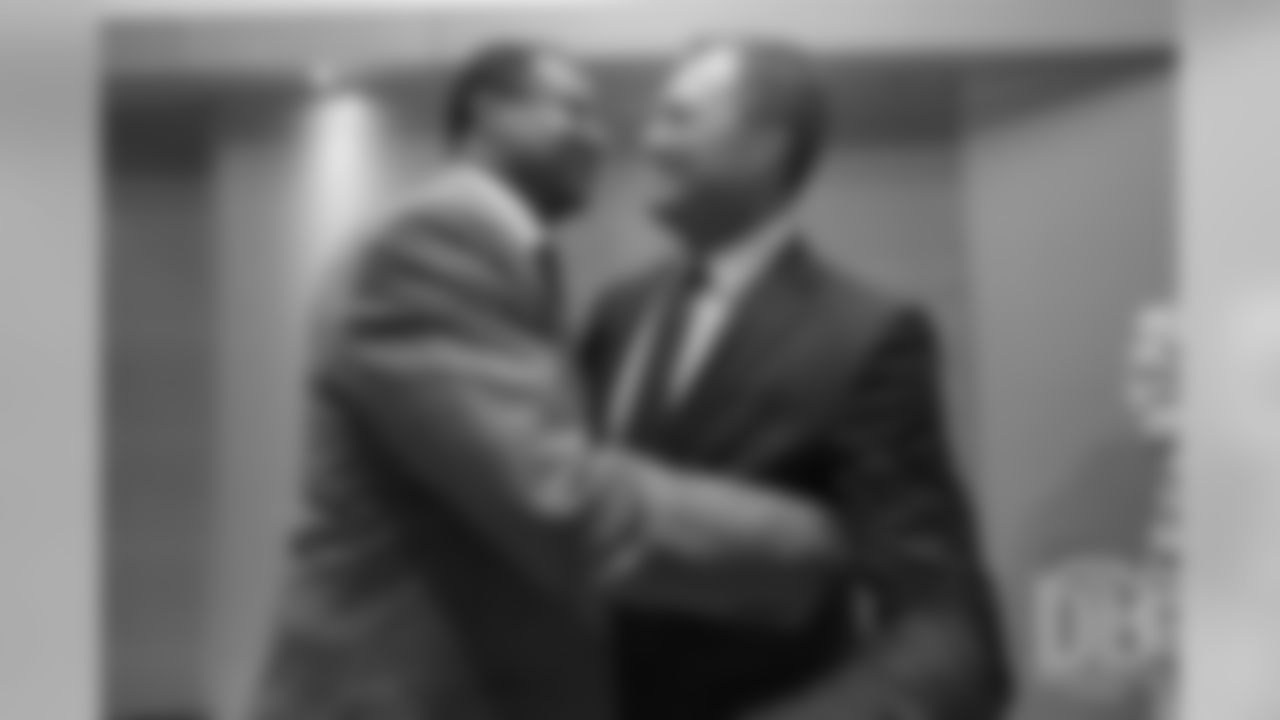 Steve Atwater greets John Lynch at the Pro Football Hall of Fame's Merlin Olsen Luncheon in Atlanta on February 1, 2019.