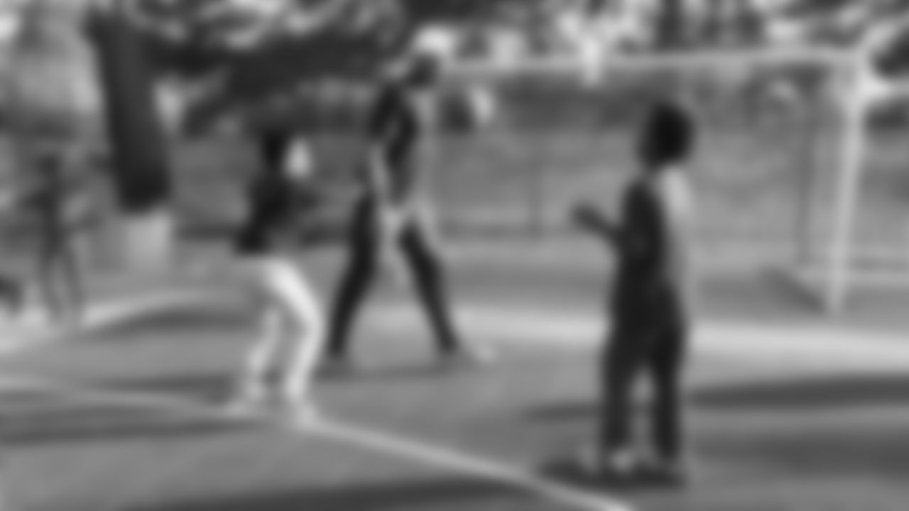 Linden Stephens plays basketball with kids after a meal-packaging event with Feeding Children Everywhere at the Denver Broncos Boys & Girls Club on May 14, 2019.