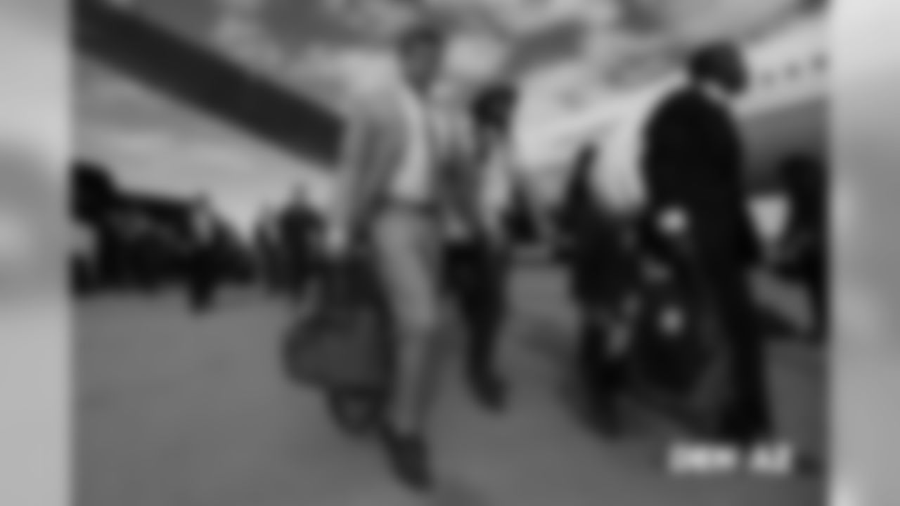 Casey Kreiter walks on the tarmac to the plane before the flight during the team's travel for their Week 7 game against the Arizona Cardinals on October 17, 2018.