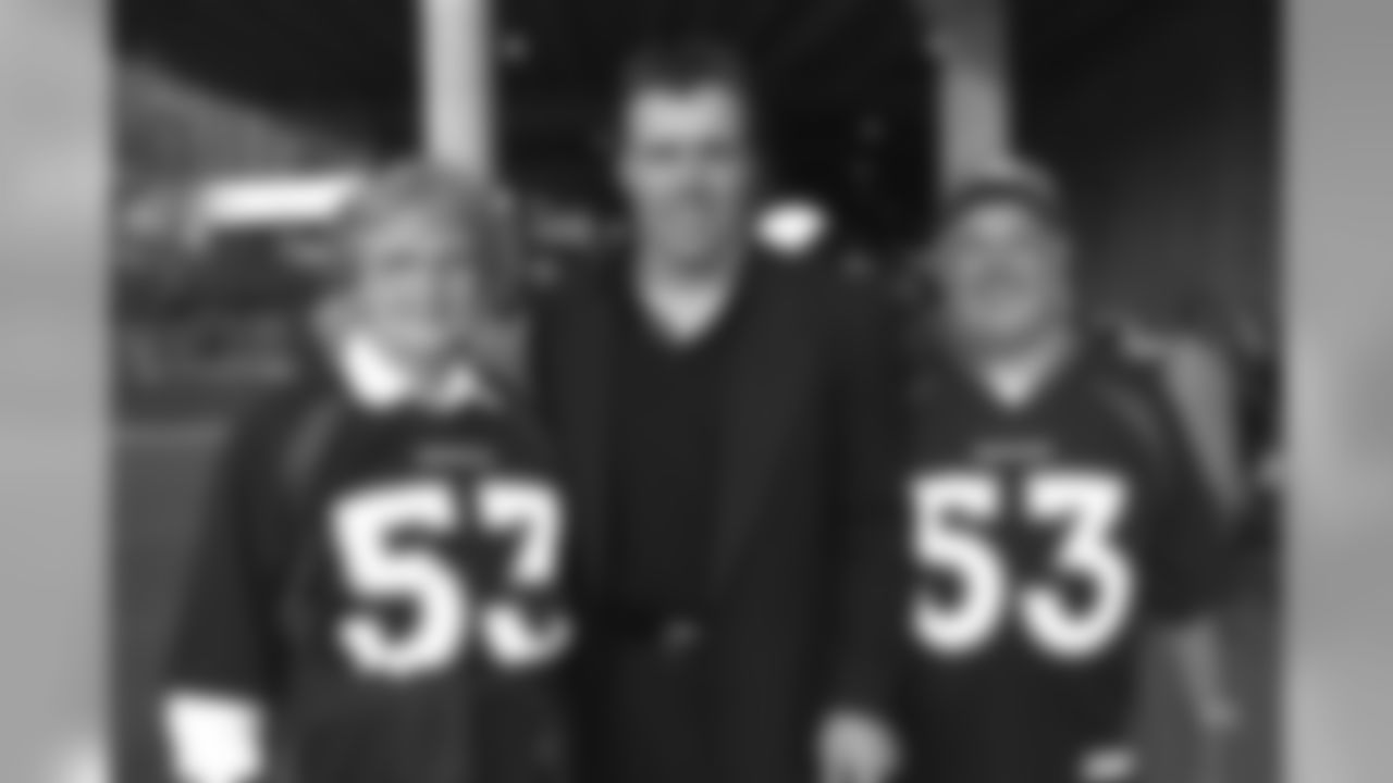Bill Romanowski spends time with his parents following the Cincinnati game against the Cincinnati Bengals at Cinergy Field in Cincinnati, OH on October 22, 2000.