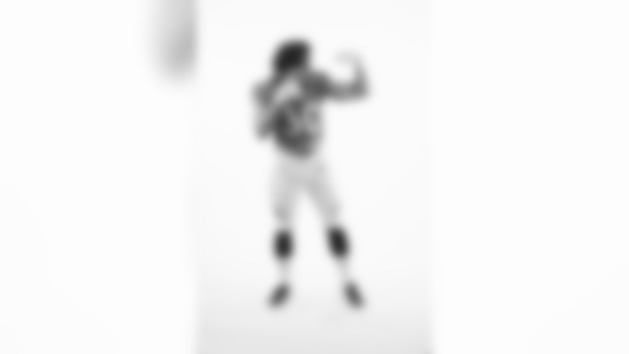 Phillip Lindsay poses for a portrait taken by team photographer Gabriel Christus.