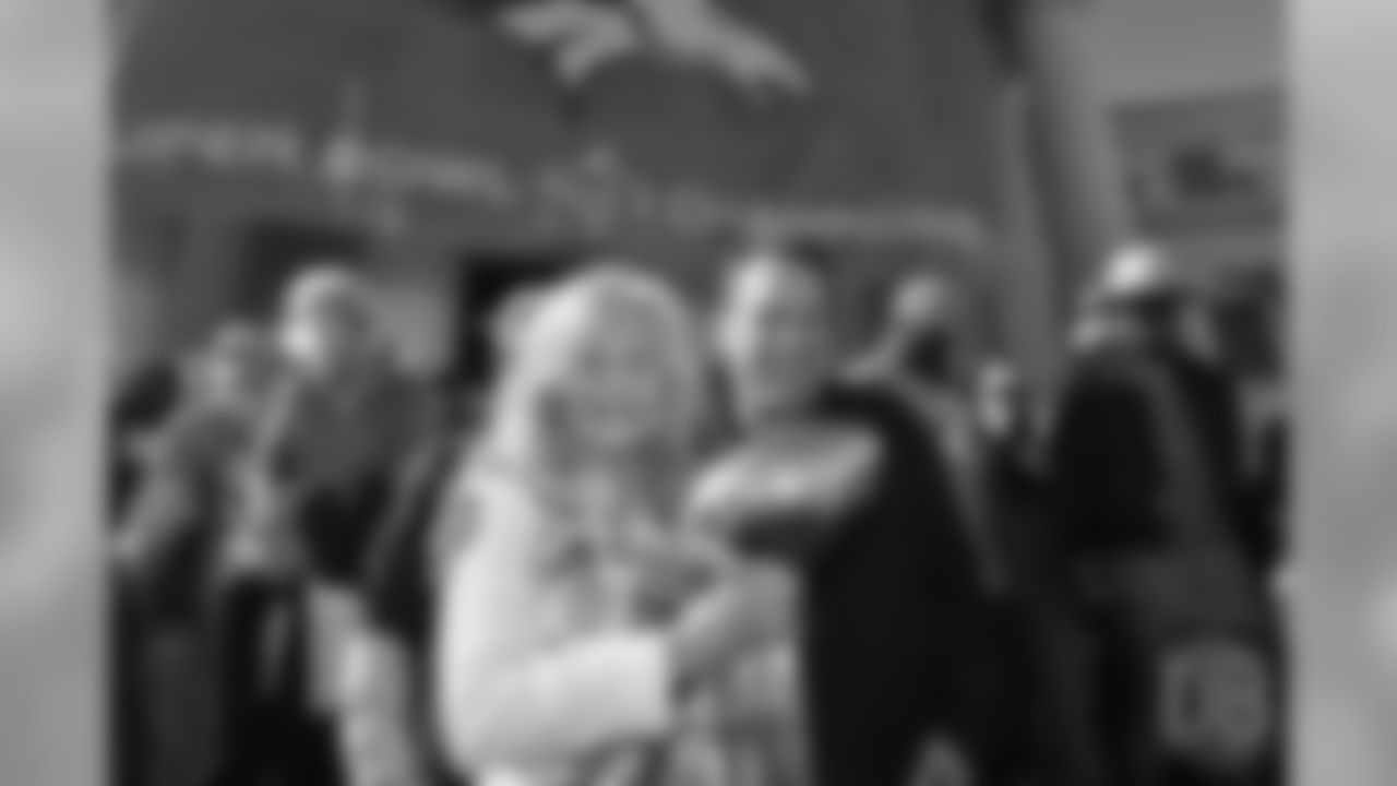 Annabel Bowlen and head coach Gary Kubiak pose for a photo with the Lombardi Trophy during the Broncos' Super Bowl 50 parade and celebration.