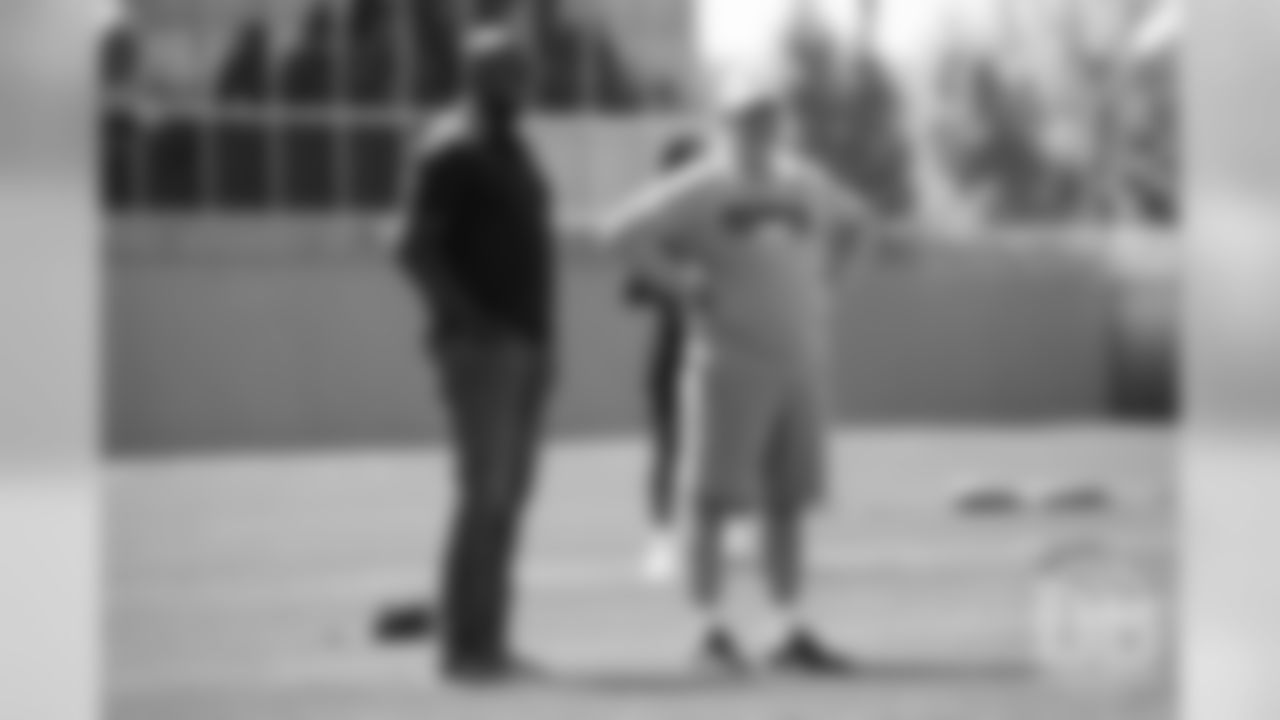 Head Coach Vic Fangio talks with University of Colorado head football coach Mel Tucker during the Broncos' practice on the ninth day of their OTAs on May 31, 2019.
