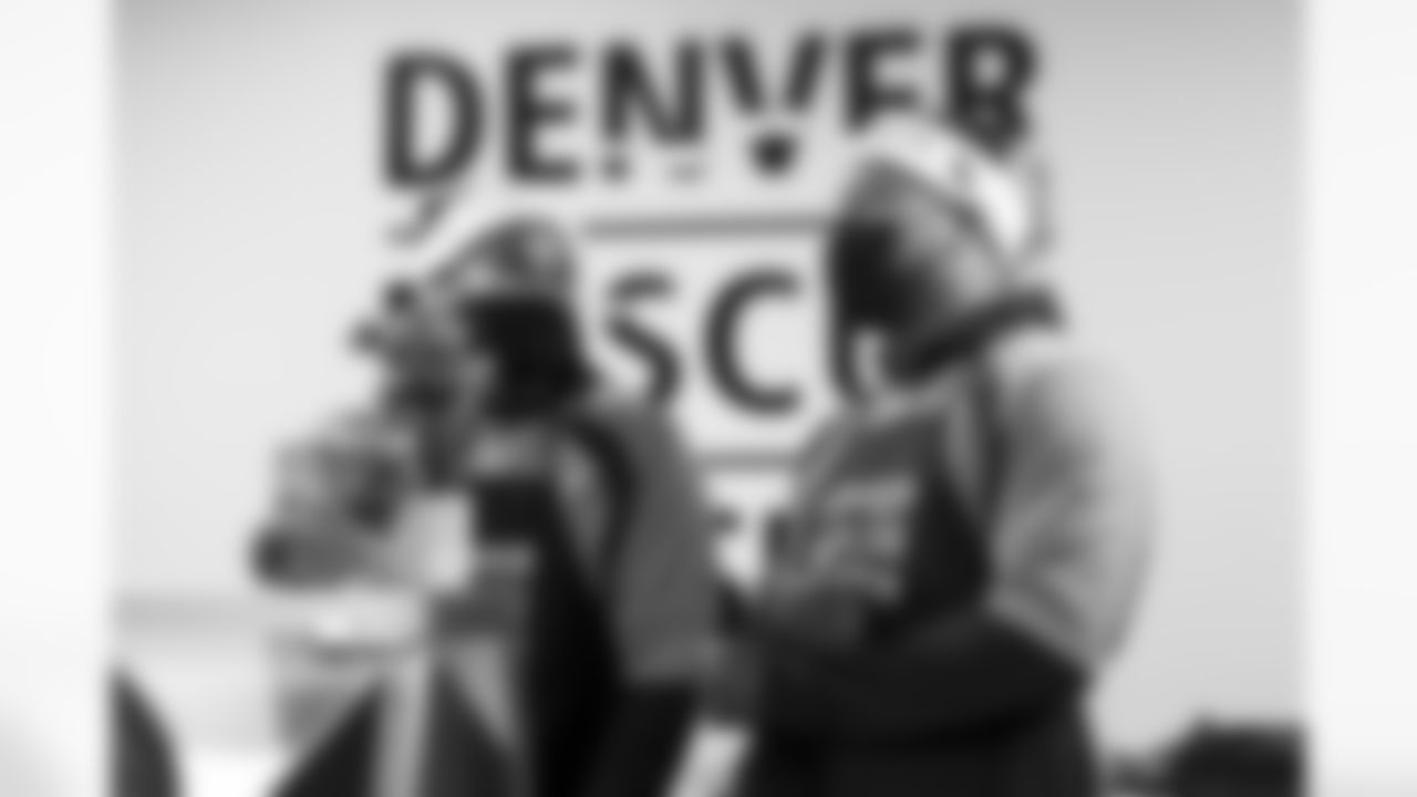 Malik Reed and Bradley Chubb during the 2021 Denver Rescue Mission Holiday Party at the Mission's The Crossing location in Denver, Colorado on December 6, 2021. (Photo by Ben Swanson)