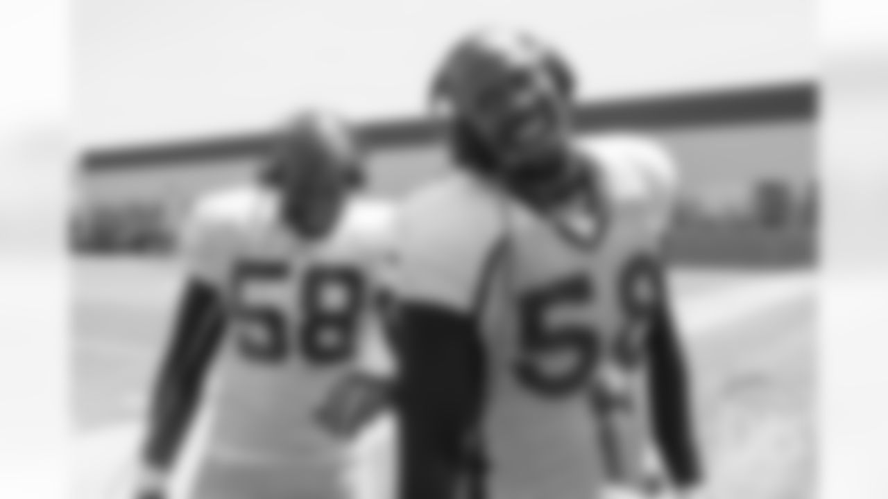 Elvis Dumervil and Von Miller, who were Broncos teammates during Miller's first years in the league