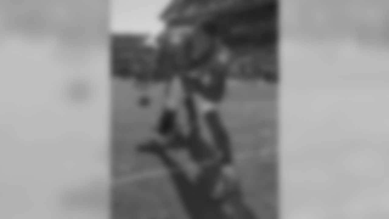 Demaryius Thomas points to the camera while he stretches before a game against the Washington Redskins on Oct. 27, 2013.