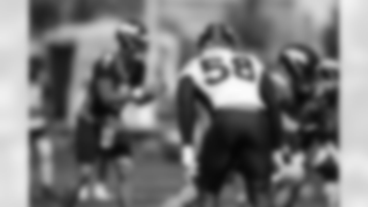 Von Miller watches as Drew Lock prepares to take a snap during the fifth training camp practice at UCHealth Training Center on August 19, 2020. (Photo by Ben Swanson)
