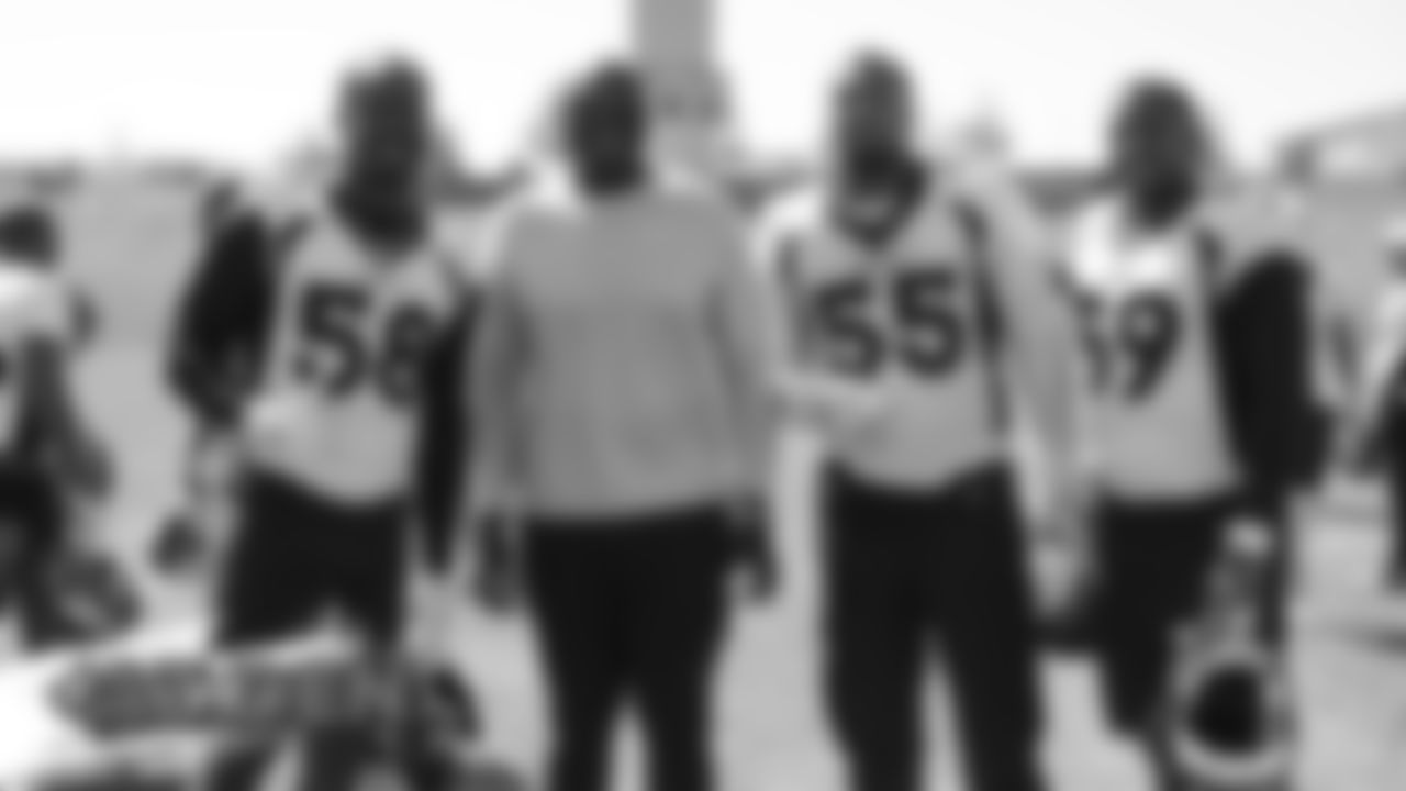 Hall of Fame pass rusher Bruce Smith poses for a photo with Von Miller, Bradley Chubb and Malik Reed at practice at UCHealth Training Center on August 26, 2019. (Photo by Ben Swanson)