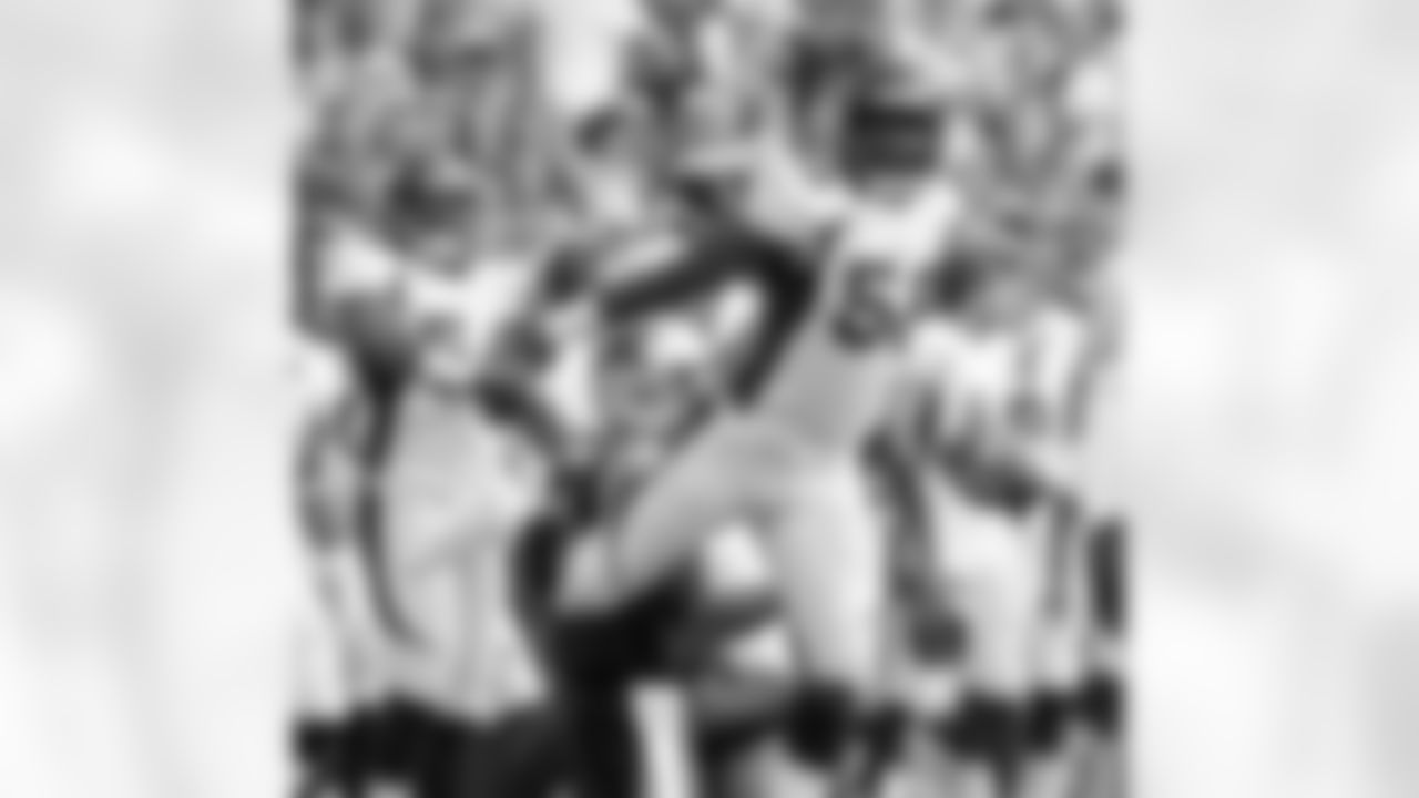 Miller sacks Newton on the first drive of the game, then mimics his signature Superman celebration.