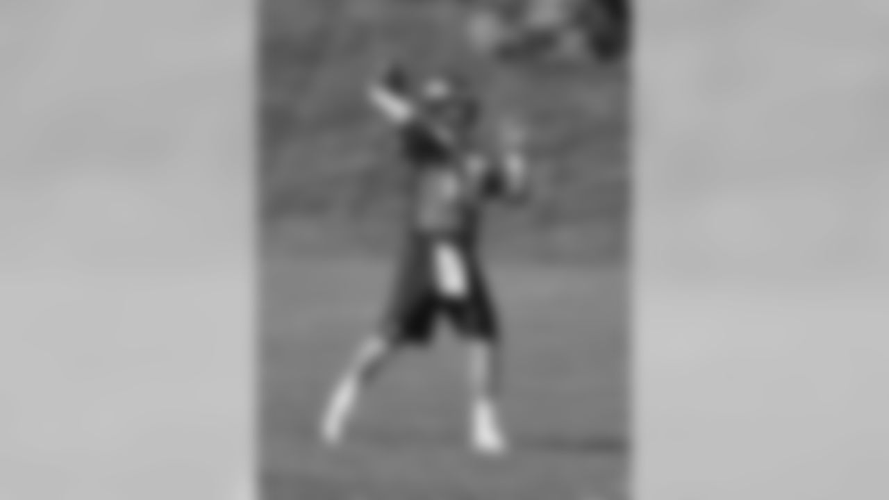 Manning fires a pass in practice.
